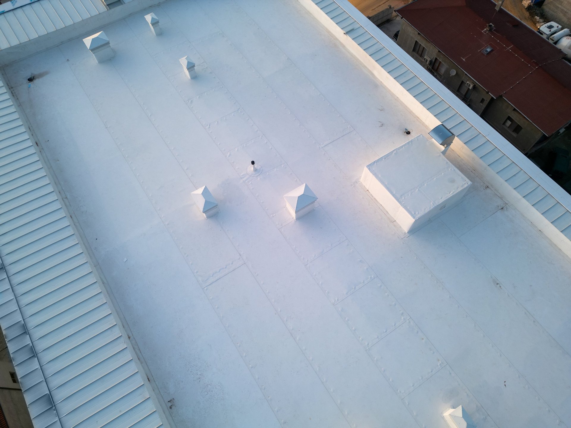 Commercial rooftop with clean TPO membrane installation