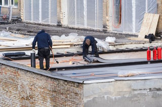 Before: worn flat roof
